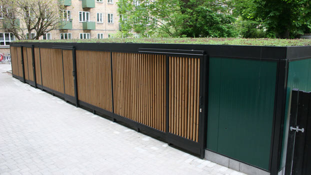 UNA multioverdækning med grønmalet brandvæg og sedumtag